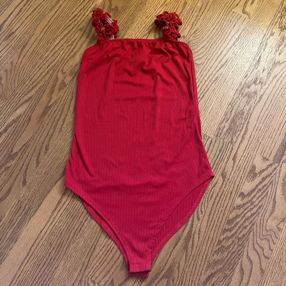 Red ribbed body suit with ruffled straps